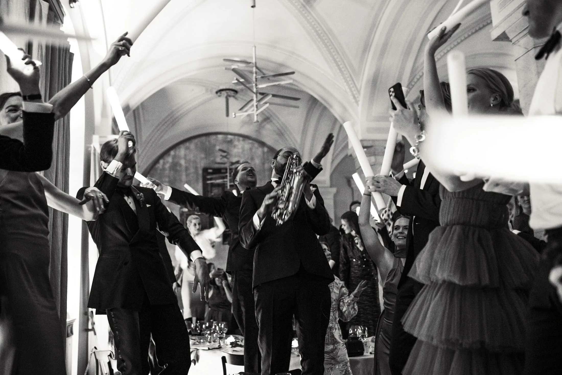 Andreas and guests celebrate together in a hall
