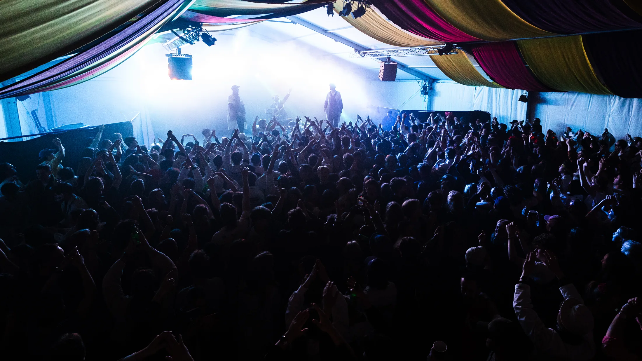 A large audience in front of the stage during a show